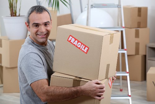 Moving boxes and furniture in a Stockwell flat removal