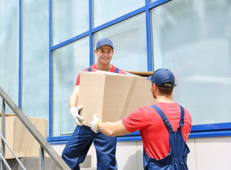 Furniture pick-up team collecting a sofa in Stockwell