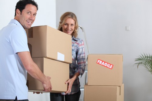 Moving crew preparing office assets and labels for transport in Stockwell